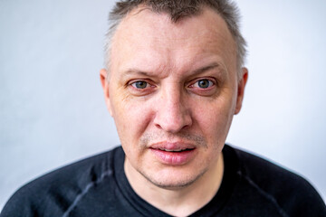 distorted face of sad and grieved very upset person, dissatisfied with his hard fate