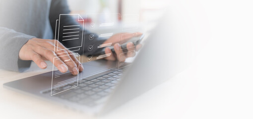 businessman on document planning the business plans and analyse  profitability of working companies with digital augmented virtual graphics for project manager working on laptop and update information