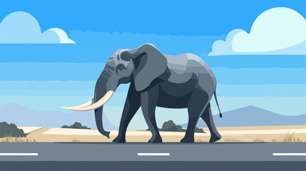 Obraz premium Majestic Elephant Walking Along Road Under Blue Sky