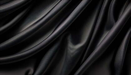 elegant black fabric gradient noise grain background with soft folds perfect for design luxury themes or as a texture overlay posters and advertising templates covers banners