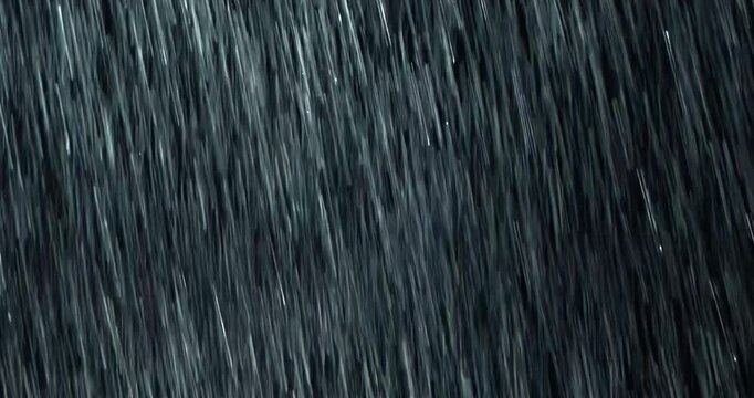 4K high-speed angled heavy rainstorm on a black surface, dynamic splashing of raindrops. High-end rain closeup VFX insert, a powerful weather element, showcasing the intense realism of the rain. 