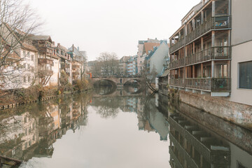 View from the Pegnitz river canals near the Maxbrucke bridge in this historic old town of Nuremberg Germany, Bavaria, with reflection, taken in winter