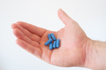 A hand full of medicines pills