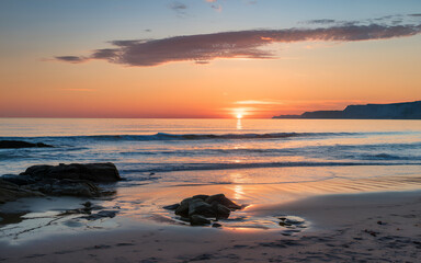 Fototapeta premium Stunning Sunset on a Serene Beach with Vibrant Sky Colors