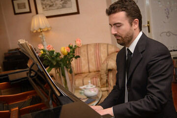 Piano music player dressed in classic suit