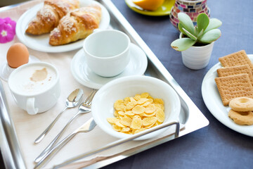 Continental breakfast coffee milk orange juice and croissant
