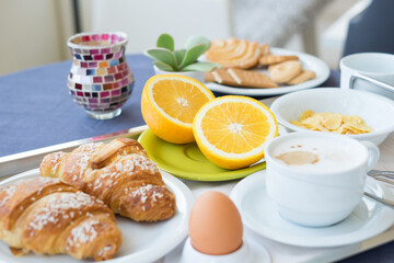 Continental breakfast coffee milk orange juice and croissant