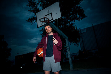 Urban basketball player in the court , vintage drama color effect