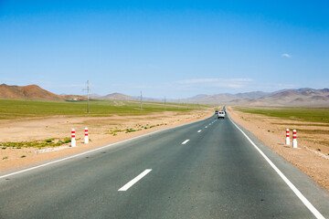 Landscape with asphalt road near Ulgii city, Mongolia