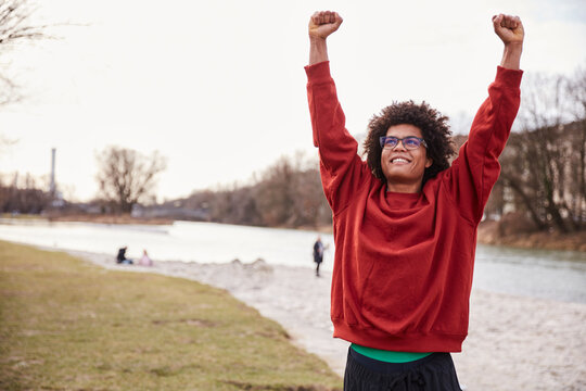 Young mixed race man celebrating while hanging out. Munich, Germany