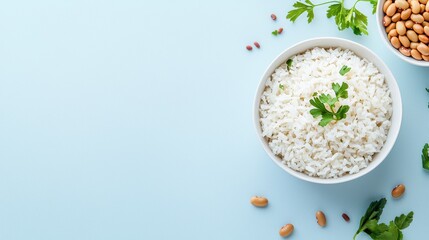 Create Budget-Friendly. Bowl of rice garnished with herbs, surrounded by nuts on a blue background.