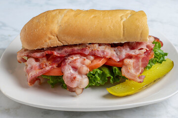  blt sub  sandwich with a pickle