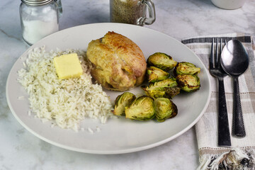 chicken thighs  with rice and brussel sprouts