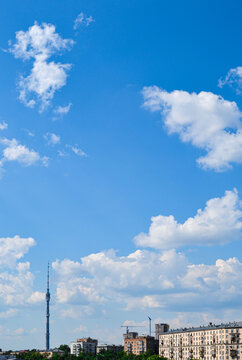 View of the Ostankino TV Tower and Alekseevsky District from the Krestovsky Overpass under the clouds on a clear summer day. Moscow, Russia. June 2020.