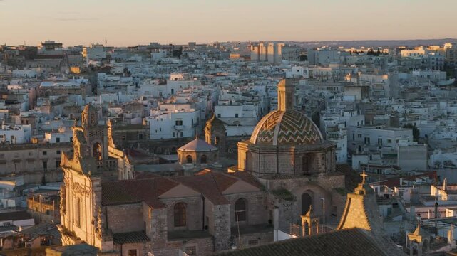 Aerial drone view of the cathedral in the old town center of Ostuni in Puglia, Italy.