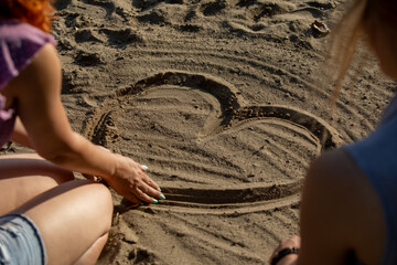 Creating a Heart Shape in the Golden Sand A Moment to Cherish Forever and Always