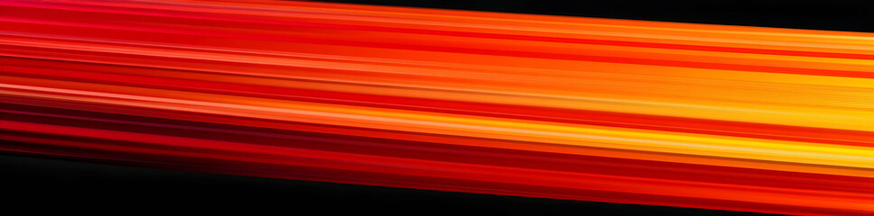 Abstract background with horizontal light stripes in red, orange, and yellow colors on a black background