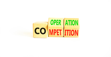 Competition or cooperation symbol. Concept word Competition or Cooperation on wooden cubes. Beautiful white table white background. Business Competition or cooperation concept. Copy space.