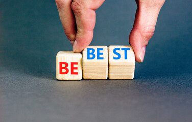 Motivational and inspirational be best symbol. Concept words Be best on beautiful wooden block. Beautiful grey background Businessman hand. Business motivational be best concept. Copy space.