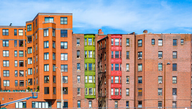 Colorful apartment buildings all in a row cretes intersting skyline
