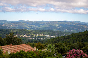 Fototapeta premium Landscape of French Riviera, view on hills, houses and green vineyards from above Cotes de Provence, production of rose wine near Saint-Tropez and Pampelonne beach, Var, France