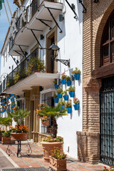 Pearl of Costa del Sol, Marbella touristic town, view of old town with white houses, decoration, narrow strets and flowers, Andalusia, Spain