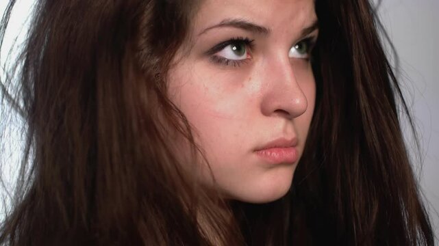 Expressive Young Woman in Studio Captured in Motion