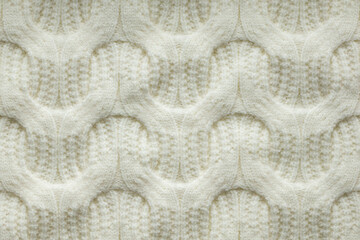 Detailed Texture of White Knitted Fabric in a Close-Up View