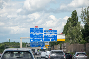Toll road, road signs and directions, driving car in summer on French road, tourists destinations...