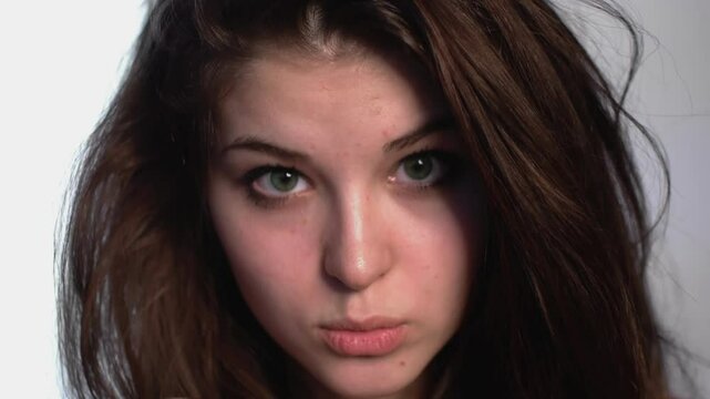 Expressive Young Woman in Studio Captured in Motion