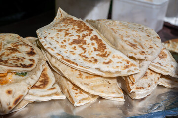 Mediterranean cuisine, fire-roasted bread flatbreads filled with cheese