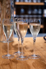 Tasting sparkling white wine, traditional champagne method making of cremant in caves on Moselle river valley in Luxembourg, wine tour and visiting caves