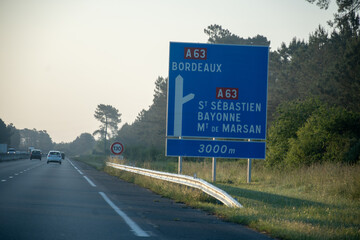 Road signs and directions, driving car in summer on French road, tourists destinations French...