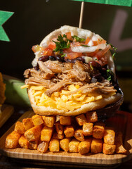 Street food, spicy chicken grilled shawarma or kebab in pita bread on weekly food market in London