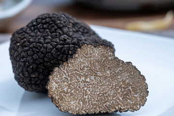 Delicious mushrooms, fresh black summer truffle mushroom in pieces for making truffle dishes with...