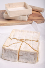 French squared pont l'eveque cow cheese from Calvados department, Normandy, France