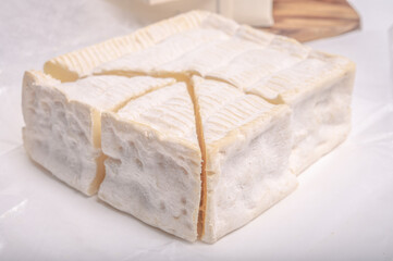 French squared pont l'eveque cow cheese from Calvados department, Normandy, France