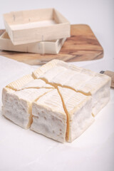 French squared pont l'eveque cow cheese from Calvados department, Normandy, France