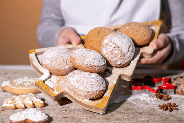 Freshly baked gingerbread cookies served on a decorative tray with festive details.