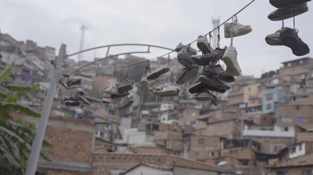 Sports shoes hanging from the electrical wiring in a South American neighborhood