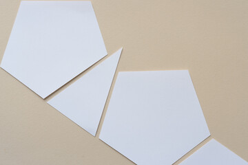 machine-cut geometric shapes on beige paper