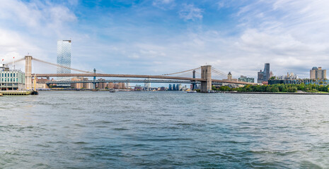 A panorama view on the East river towards the Brooklyn and the Brooklyn bridge in New York, in the fall