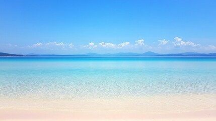 Fototapeta premium Serene Beach Seascape: Turquoise Water, White Sand, and Distant Mountains