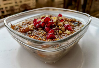Ashure dessert with legumes and dried fruits named aşure or asure . Noah’s pudding in the bowl.