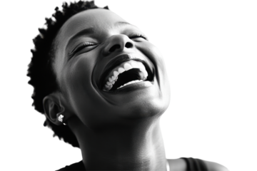 Joyful young women laughing heartily against a bright white background capturing pure happiness and spontaneity