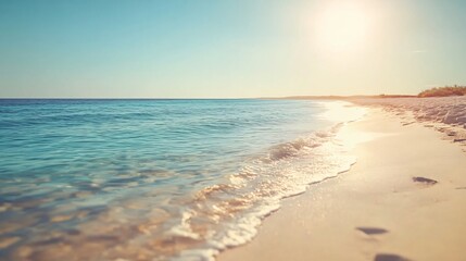 Obraz premium Serene Beach Sunset: Tranquil Ocean Waves on Sandy Shore