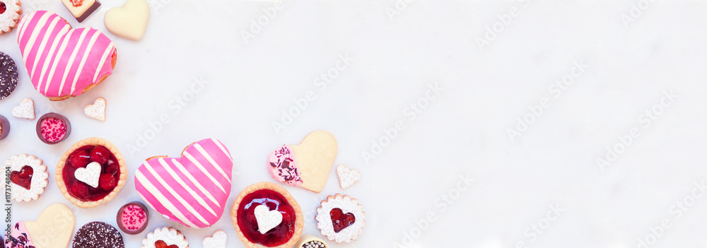 Poster valentines day baking corner border with a variety of cookies, chocolates and sweets. top down view 