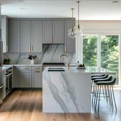 light gray slim shaker kitchen cabinets in a modern kitchen with bright lighting and a waterfall countertop