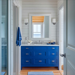 a modern nantucketinspired home main bathroom with a cobalt blue vanity