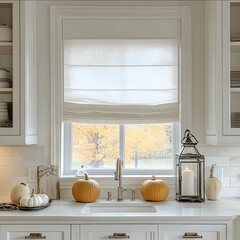 white roman shades in a harvest home aesthetic kitchen with two pumpkins on the counter and candles in lanterns